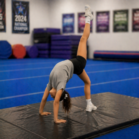 Tumbling Young athlete performing a back walkover during tumbling practice at Yuba Sutter Cheer Athletics